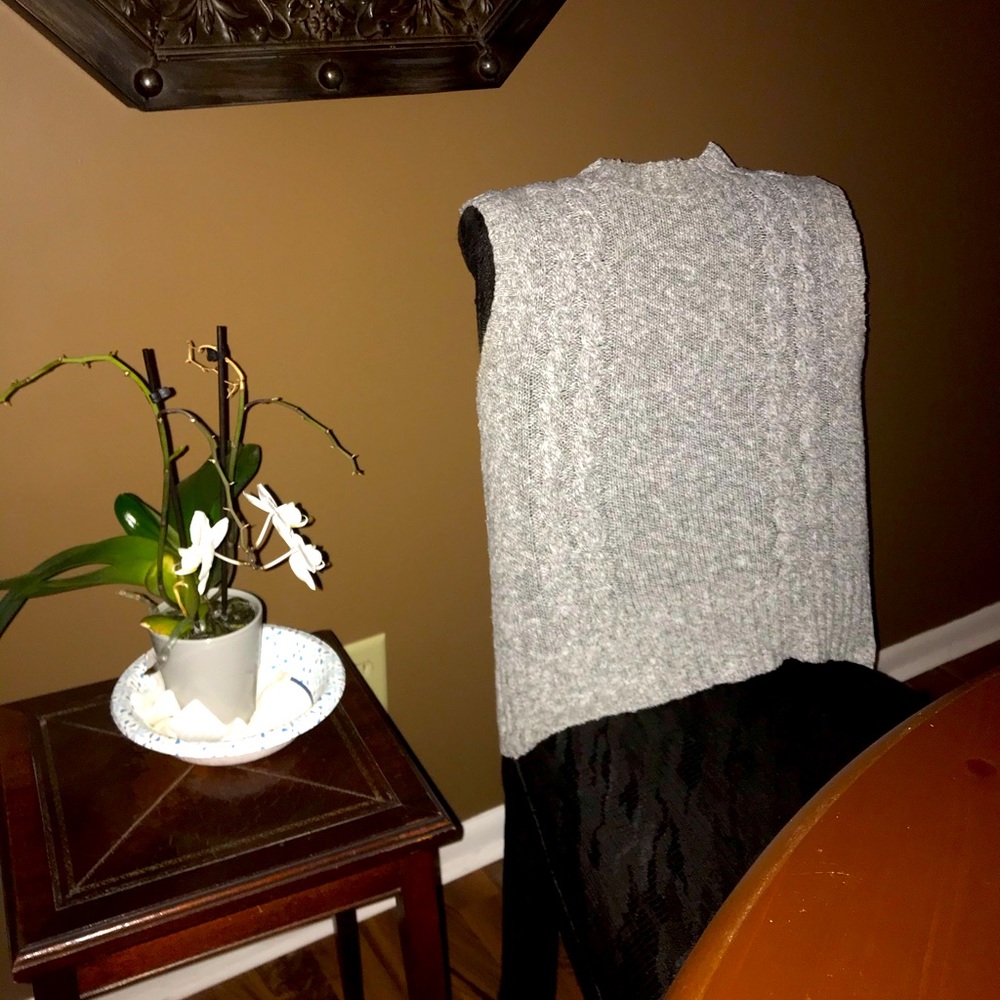 Gray and white sleeveless cable knit sweater